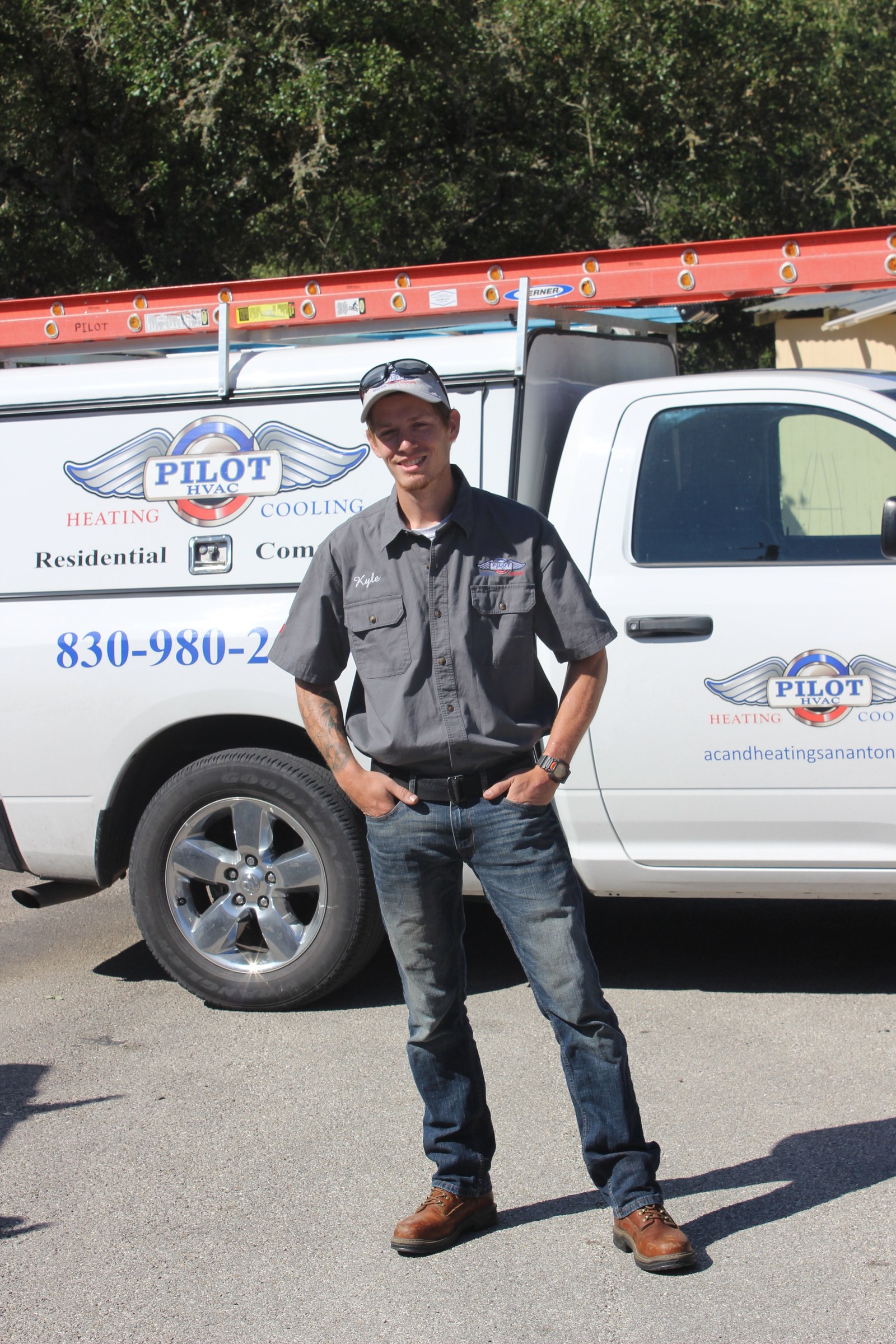 A Pilot team member standing by a Pilot service truck