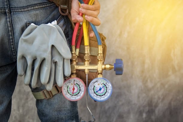 Manifold gauges connected during an air conditioning repair